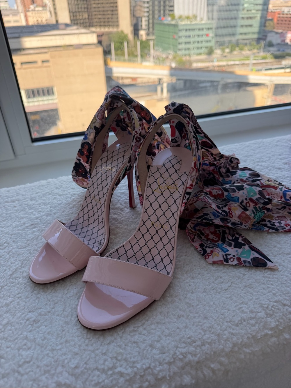 Pink Christian Louboutin tie around heels